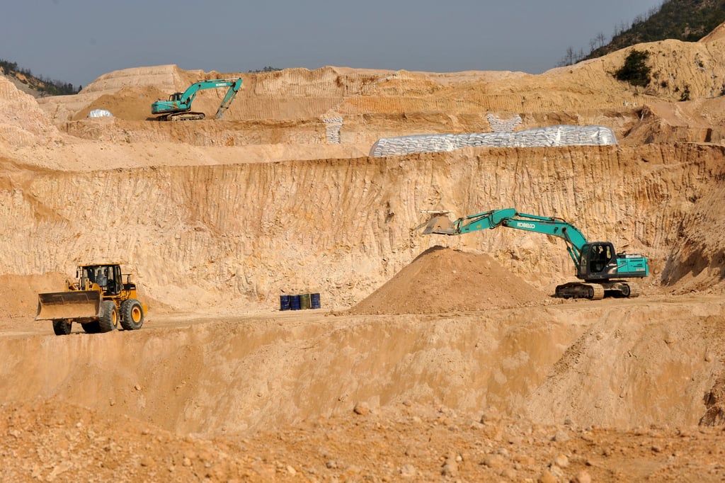Workers dig at a rare earth mine in central China’s Jiangxi province. Photo: Chinatopix via AP Workers dig at a rare earth mine in central China’s Jiangxi province. Photo: Chinatopix via AP