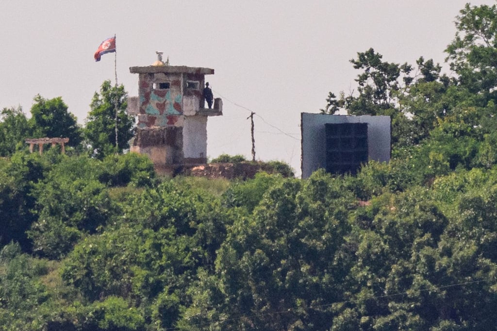 A North Korean soldier stands guard in a watchtower next to a giant loudspeaker (right) near the demilitarised zone dividing the two Koreas on June 12. Photo: AFP A North Korean soldier stands guard in a watchtower next to a giant loudspeaker (right) near the demilitarised zone dividing the two Koreas on June 12. Photo: AFP