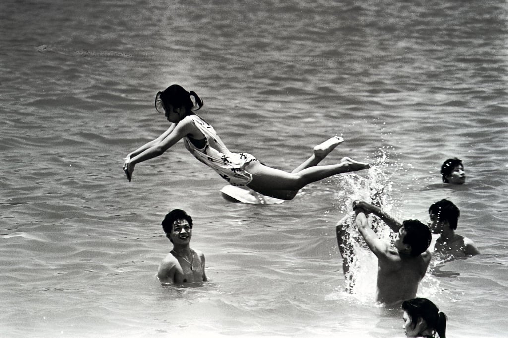 A young woman gets a friend to act as her diving board as they have fun in the sea off Repulse Bay’s beach in August 1987. Photo: SCMP Archives A young woman gets a friend to act as her diving board as they have fun in the sea off Repulse Bay’s beach in August 1987. Photo: SCMP Archives