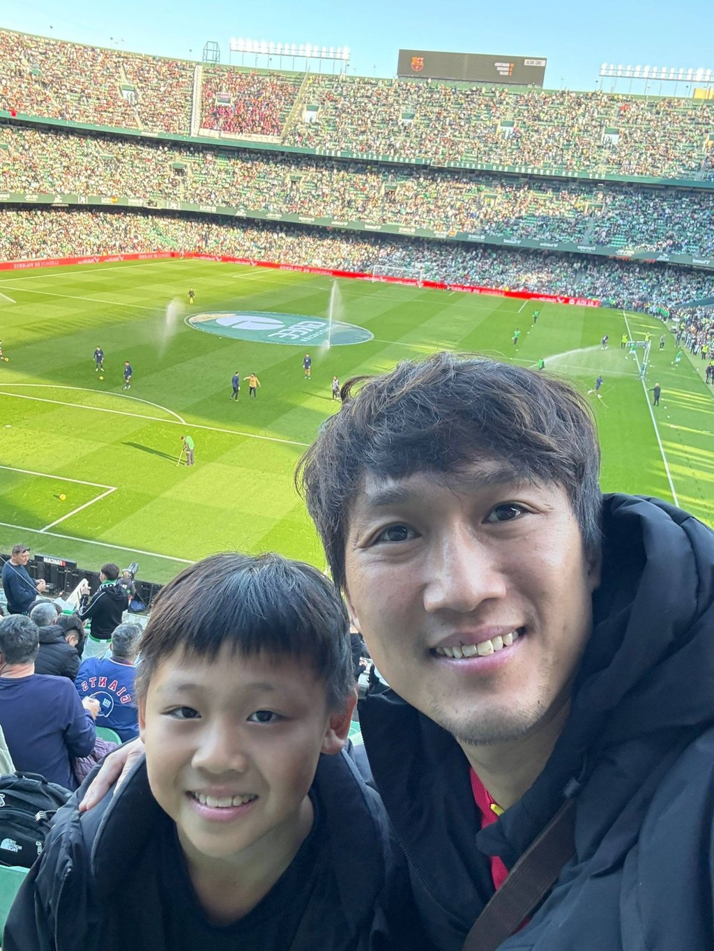 So Loi-keung and son Johnny watch Real Betis. Photo: Handout So Loi-keung and son Johnny watch Real Betis. Photo: Handout