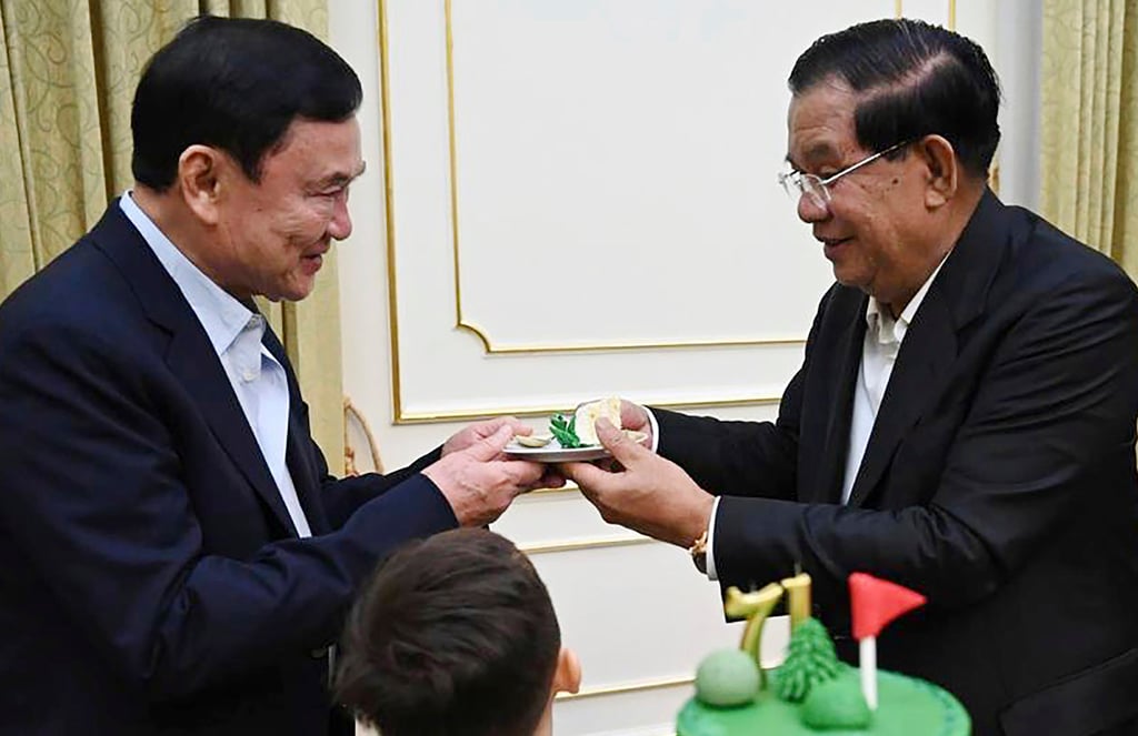 Hun Sen (right) gives a slice of cake to former Thai prime minister Thaksin Shinawatra during a party to celebrate the former Cambodian premier’s birthday on August 5, 2023. Photo: Cambodia’s Prime Minister Telegram/AP Hun Sen (right) gives a slice of cake to former Thai prime minister Thaksin Shinawatra during a party to celebrate the former Cambodian premier’s birthday on August 5, 2023. Photo: Cambodia’s Prime Minister Telegram/AP