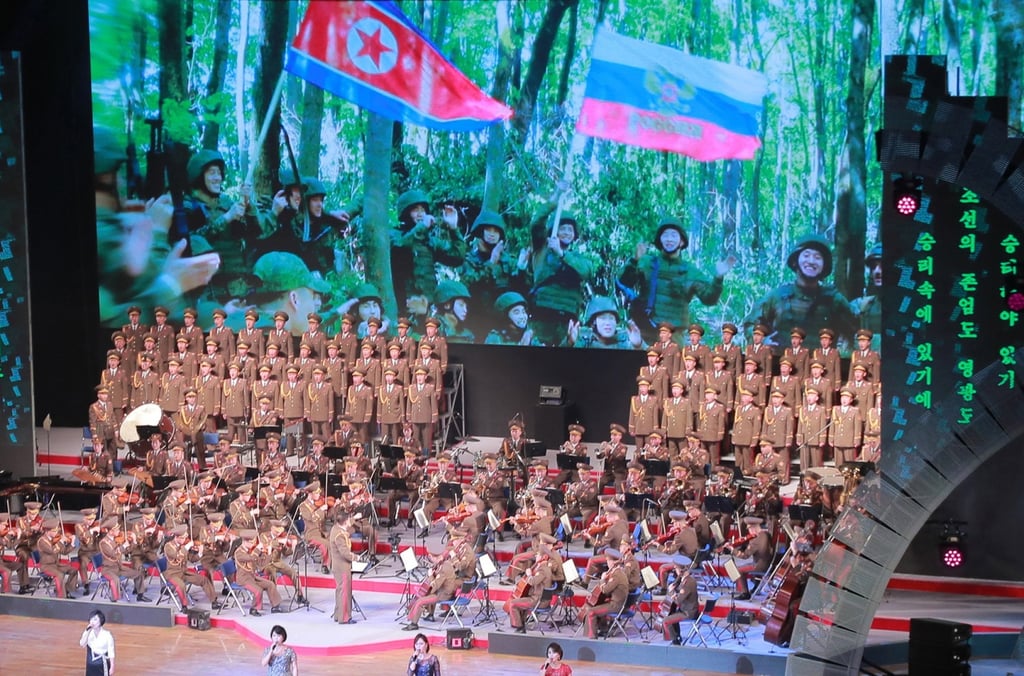 Footage showing soldiers waving North Korean and Russian flags is seen at the gala performance. Photo: KCNA / EPA Footage showing soldiers waving North Korean and Russian flags is seen at the gala performance. Photo: KCNA / EPA