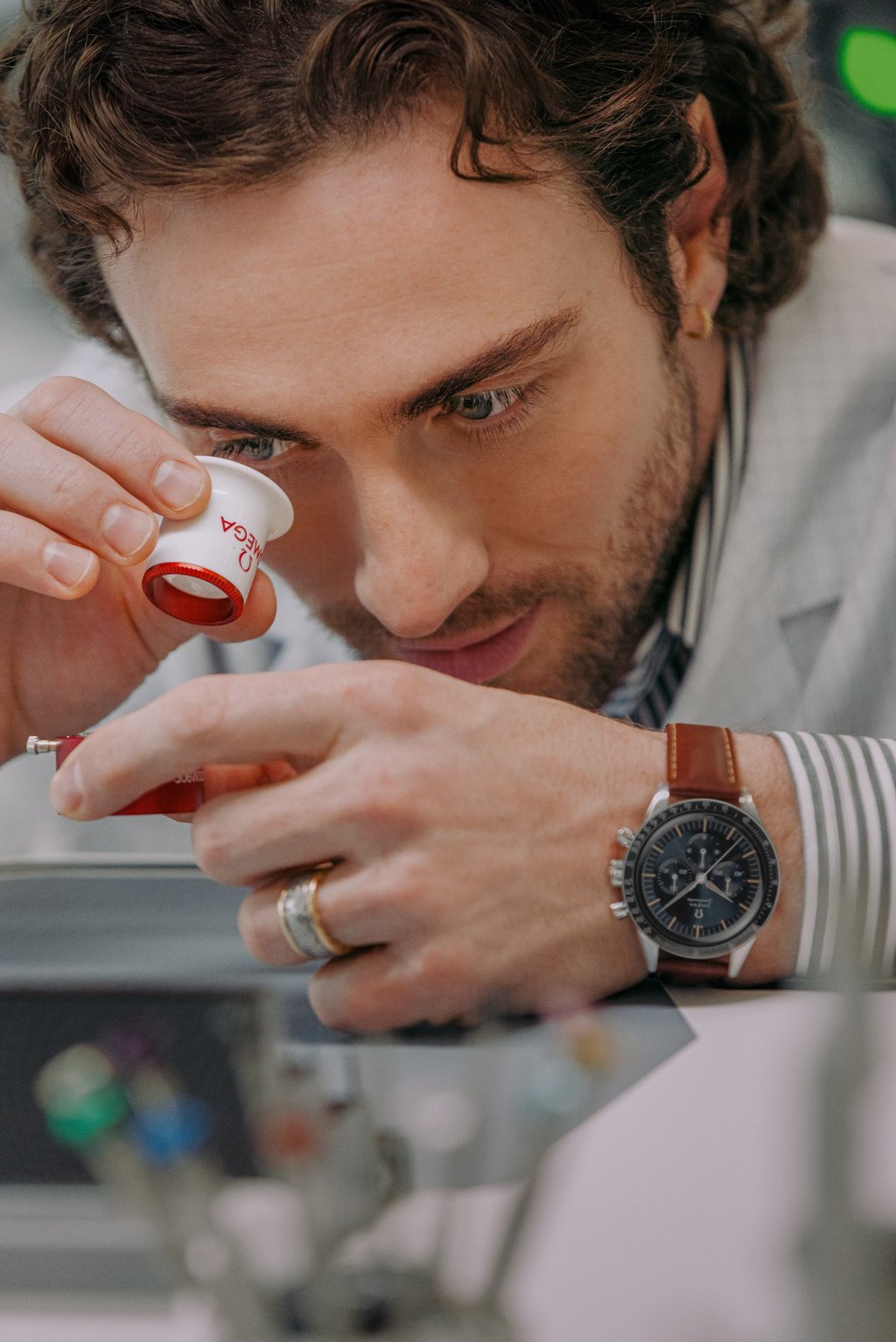 Aaron Taylor-Johnson wears the Omega Speedmaster First Omega In Space to visit the brand’s headquarters as its new ambassador. Photo: Handout