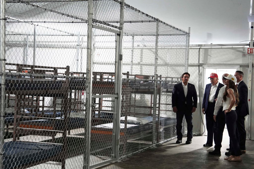 US President Donald Trump, Florida Governor Ron DeSantis, US Homeland Security Secretary Kristi Noem and others tour ‘Alligator Alcatraz’ on Tuesday. Photo: AP