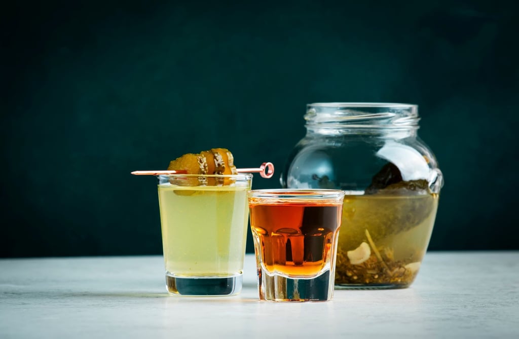 A pickleback is basically a shot of whiskey with a pickle brine chaser. Photo: Shutterstock