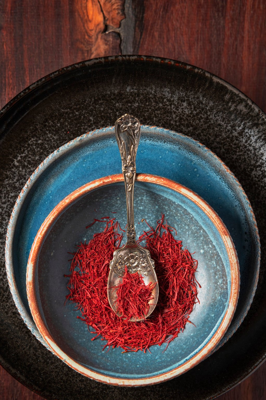 Saffron threads on stoneware with an antique spoon. Photo: Getty Images