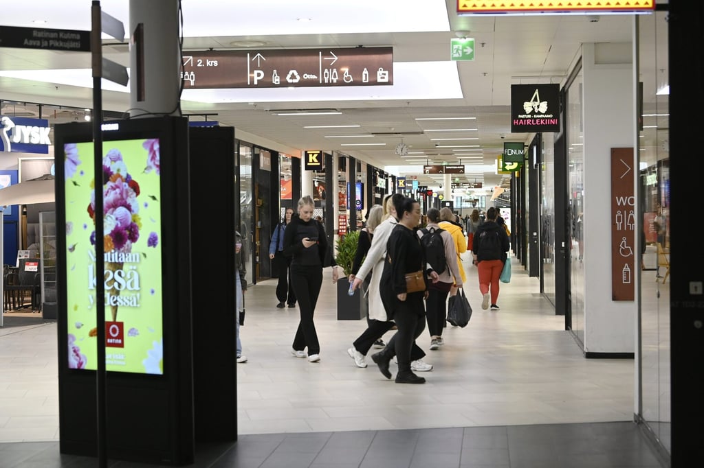 Shoppers are seen inside the Ratina shopping centre, near where several people were stabbed on Thursday. Photo: dpa