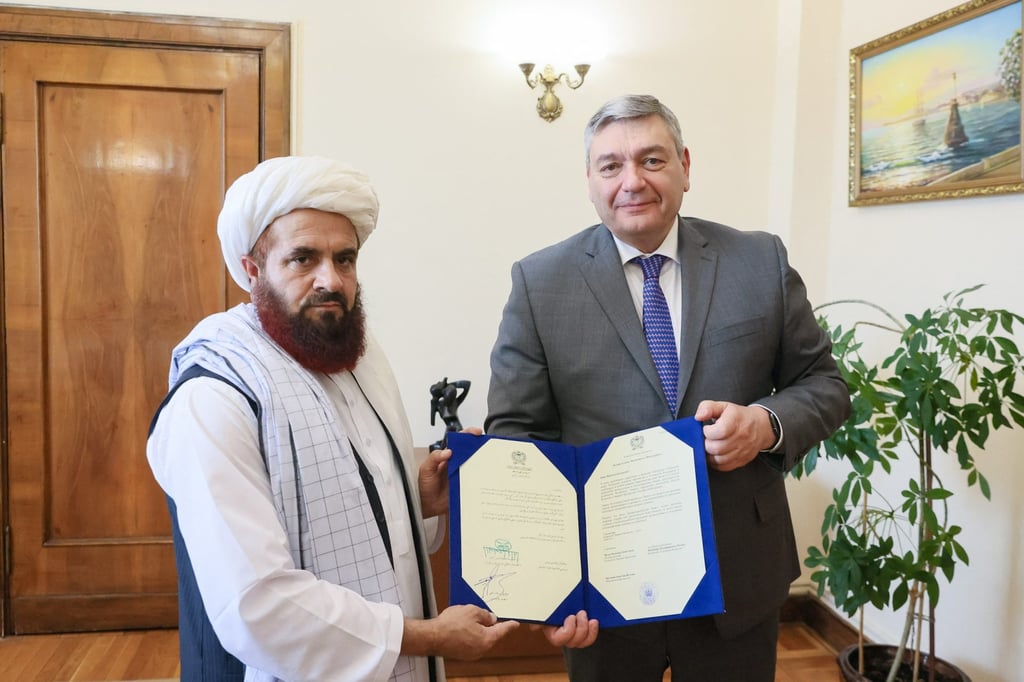 The newly appointed Taliban envoy to Moscow Gul Hassan hands copies of his credence letters to Deputy Foreign Minister Andrei Rudenko in Moscow. Photo: Russian foreign ministry via AFP The newly appointed Taliban envoy to Moscow Gul Hassan hands copies of his credence letters to Deputy Foreign Minister Andrei Rudenko in Moscow. Photo: Russian foreign ministry via AFP