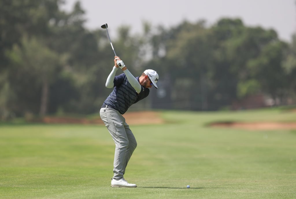 John Catlin hits his second shot on the 598-yard par-5 5th hole during the first round of the International Series Morocco. Photo: Asian Tour