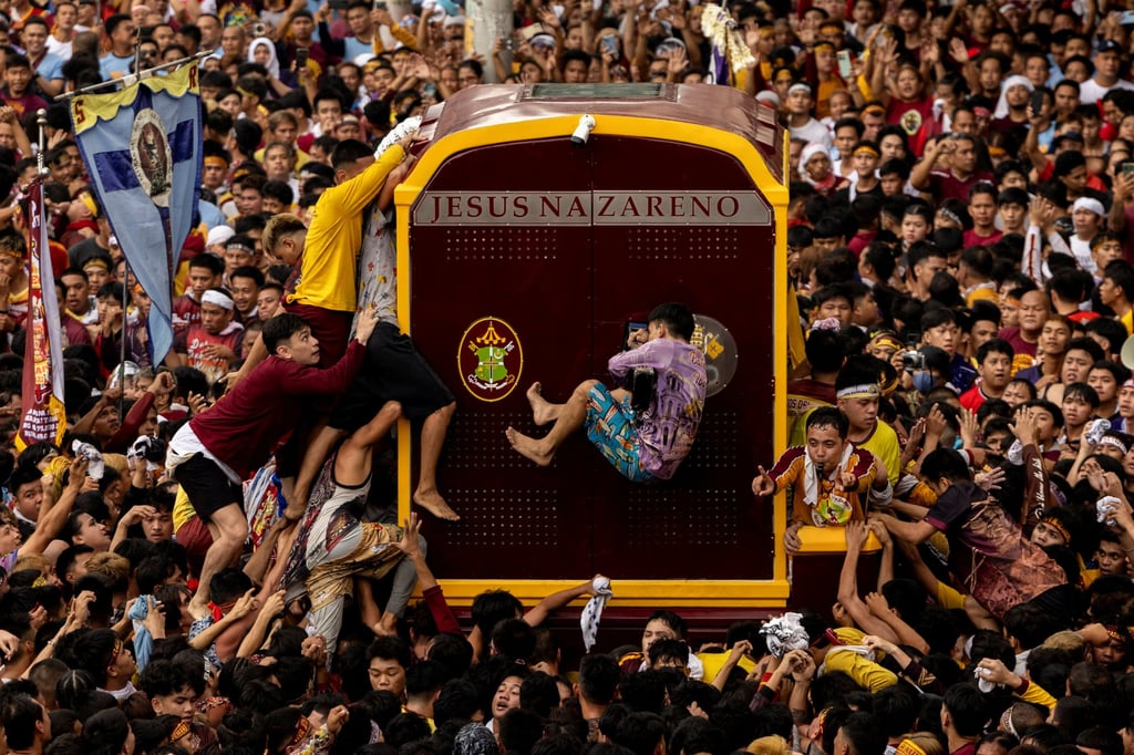 Filipino Catholic devotees jostle to touch the carriage carrying the statue of the Black Nazarene during the annual procession on its feast day in Manila on January 9. Nearly 79 per cent of Filipinos are Roman Catholic. Photo: Reuters Filipino Catholic devotees jostle to touch the carriage carrying the statue of the Black Nazarene during the annual procession on its feast day in Manila on January 9. Nearly 79 per cent of Filipinos are Roman Catholic. Photo: Reuters