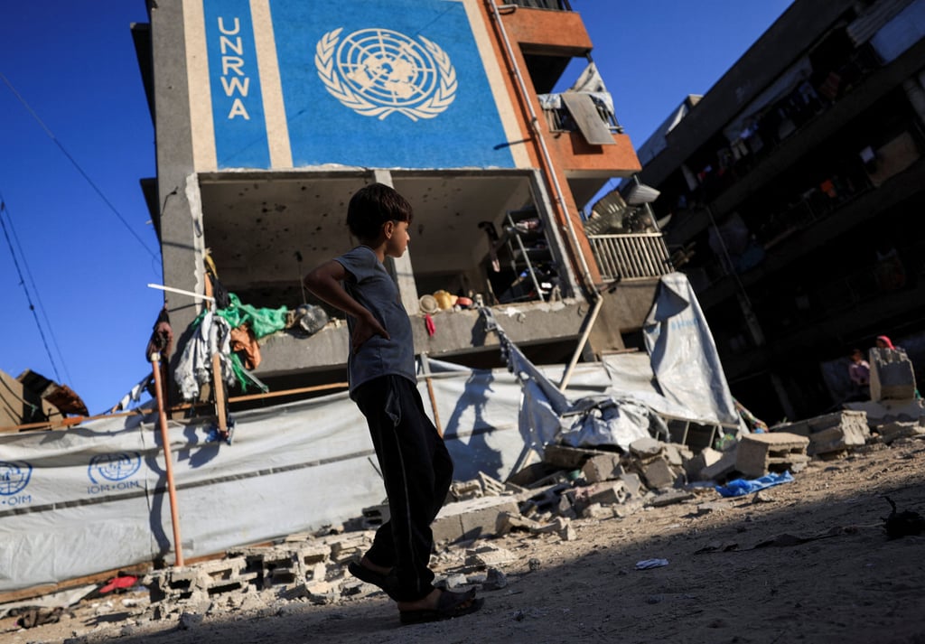 A Palestinian boy on Saturday walks near a school sheltering displaced people after it was hit in an overnight Israeli strike on Gaza City. Photo: Reuters A Palestinian boy on Saturday walks near a school sheltering displaced people after it was hit in an overnight Israeli strike on Gaza City. Photo: Reuters