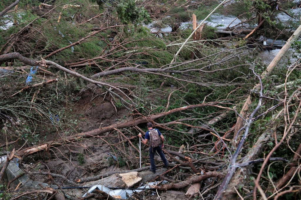 A man searches in Hunt, Texas. Photo: Reuters A man searches in Hunt, Texas. Photo: Reuters