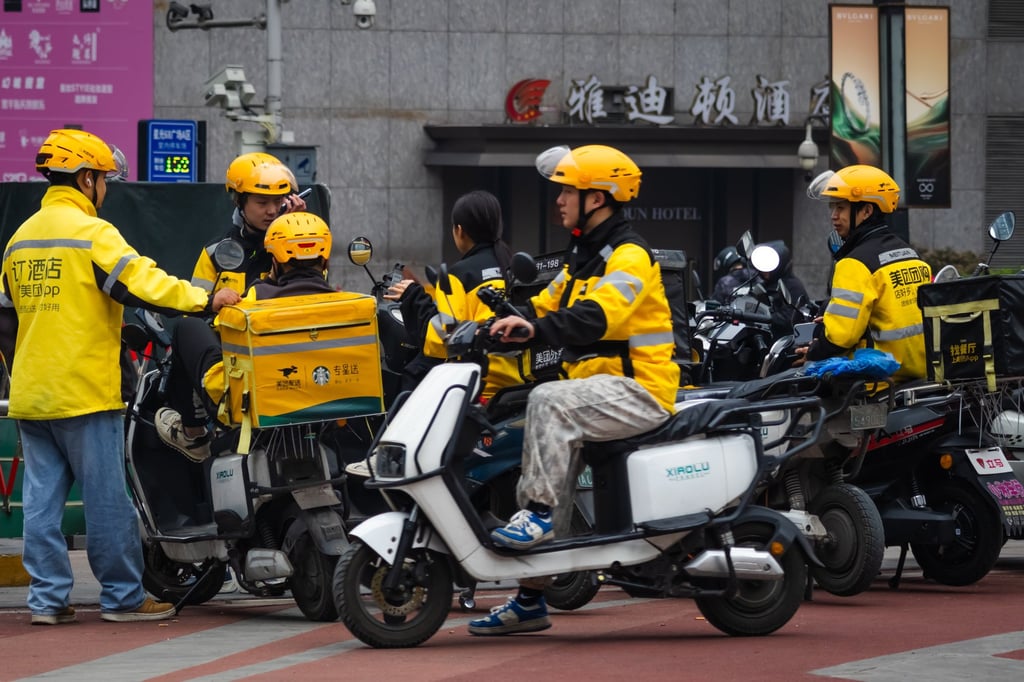 A group of Meituan food delivery couriers wait for new orders on March 22, 2025 in Chongqing, China. Photo: Getty Images A group of Meituan food delivery couriers wait for new orders on March 22, 2025 in Chongqing, China. Photo: Getty Images