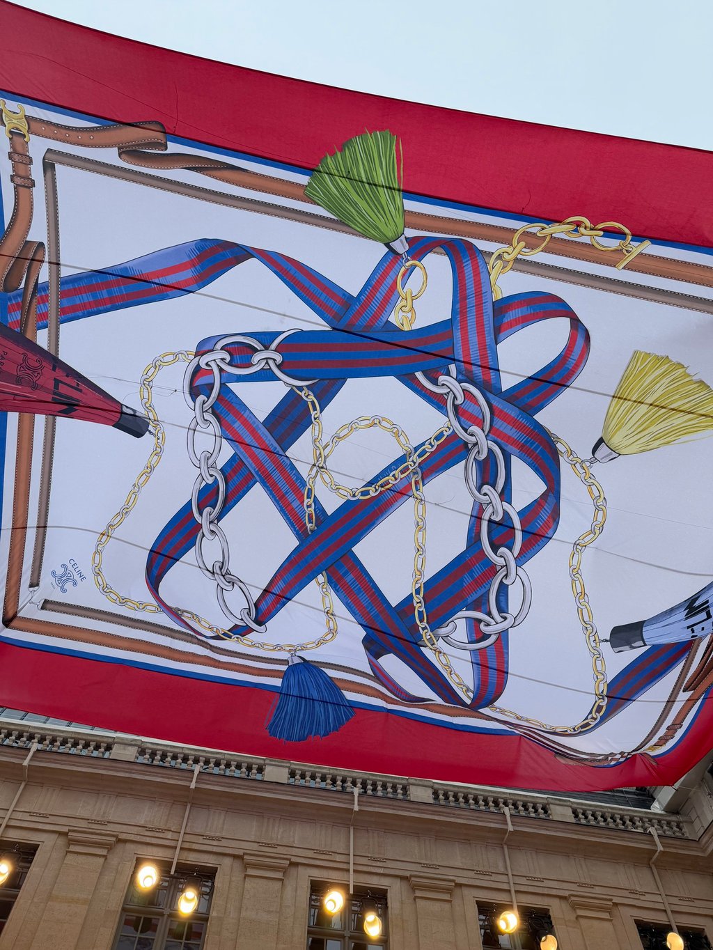 A giant silk scarf hung over the courtyard of Celine’s headquarters for the spring 2026 show. Photo: Vincenzo La Torre