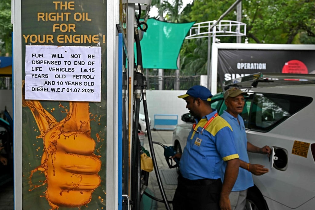 A notice announcing the ban on refuelling petrol cars older than 15 years and diesel vehicles older than 10 years, is displayed at a gas station in New Delhi on July 1. Photo: AFP