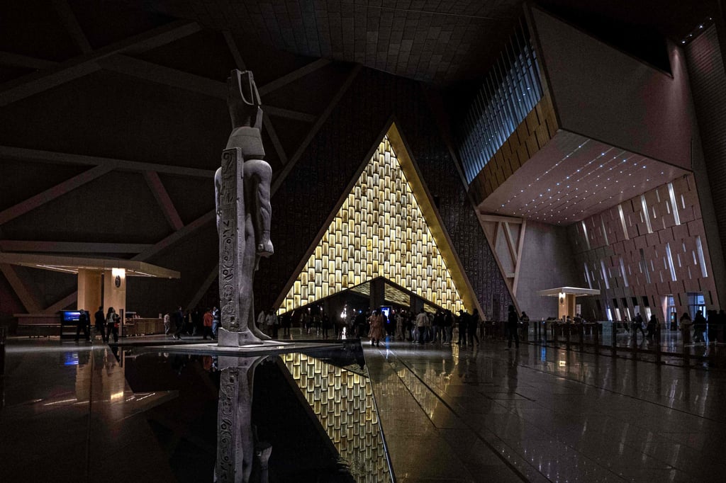 Visitors walk next to a 3,200-year-old colossal pink-granite statue of King Ramses II at the entrance of the Grand Egyptian Museum in Giza, Egypt, on February 7, 2025, ahead of the museum’s planned opening later in the year. Photo: AFP Visitors walk next to a 3,200-year-old colossal pink-granite statue of King Ramses II at the entrance of the Grand Egyptian Museum in Giza, Egypt, on February 7, 2025, ahead of the museum’s planned opening later in the year. Photo: AFP