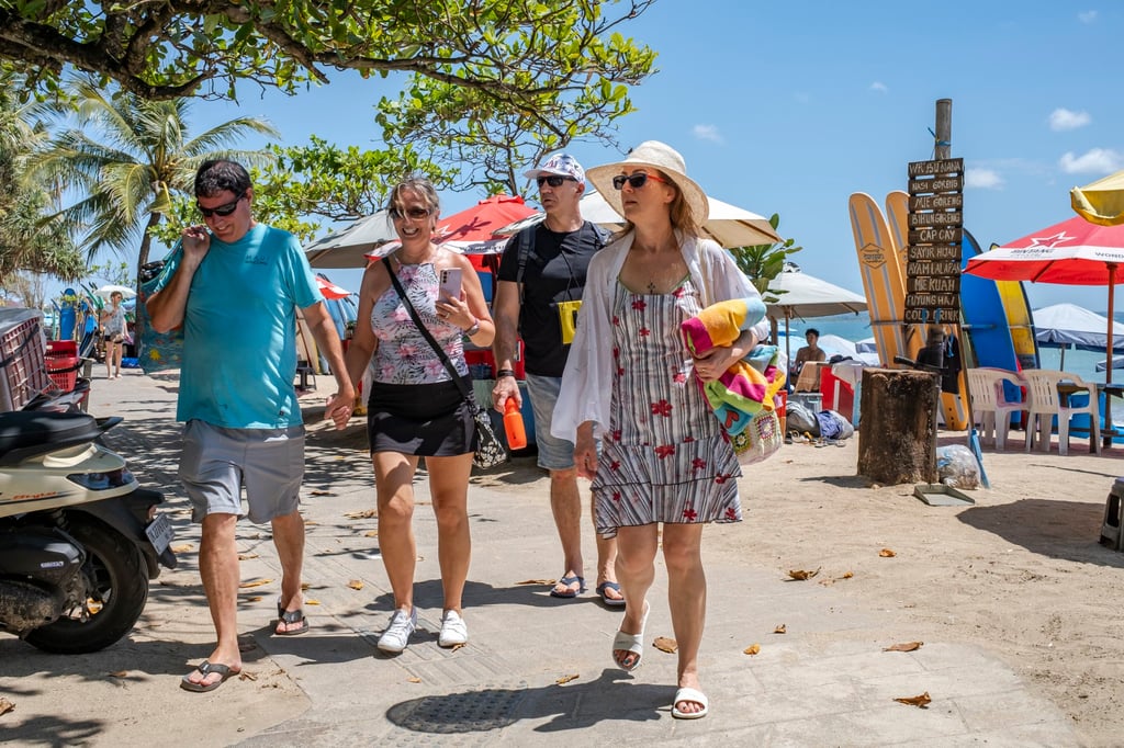 Tourists at Kuta Beach in Bali. More residents are complaining about overtourism on the island. Photo: EPA-EFE Tourists at Kuta Beach in Bali. More residents are complaining about overtourism on the island. Photo: EPA-EFE