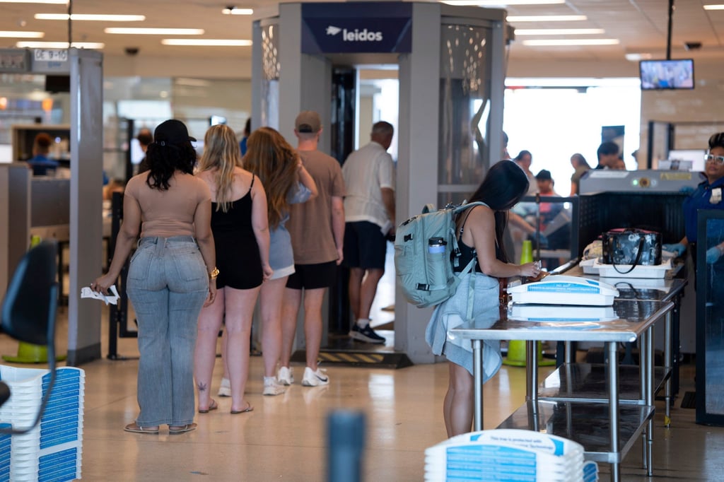 People enter a security checkpoint at Philadelphia International Airport on Tuesday. Photo: AP