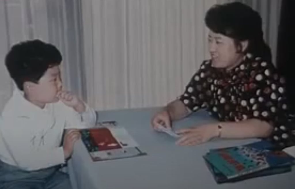 Ko Yong-hui with a young Kim Jong-un in a North Korean documentary. Photo: Yoji Gomi Ko Yong-hui with a young Kim Jong-un in a North Korean documentary. Photo: Yoji Gomi