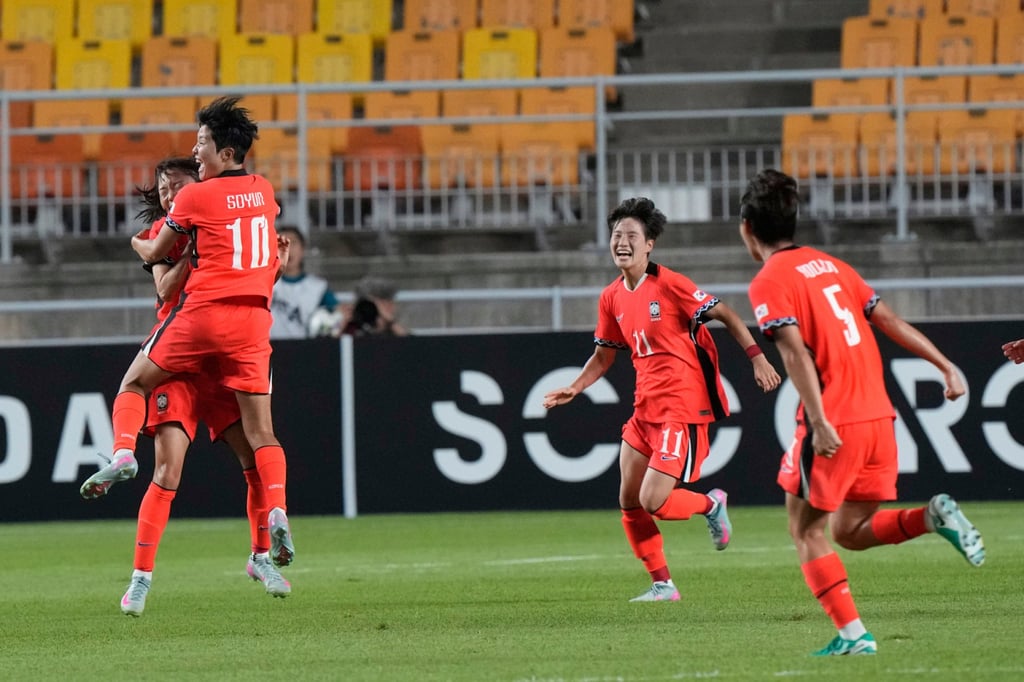 Ji So-yun (No 10) celebrates her brilliant equaliser against China. Photo: AP