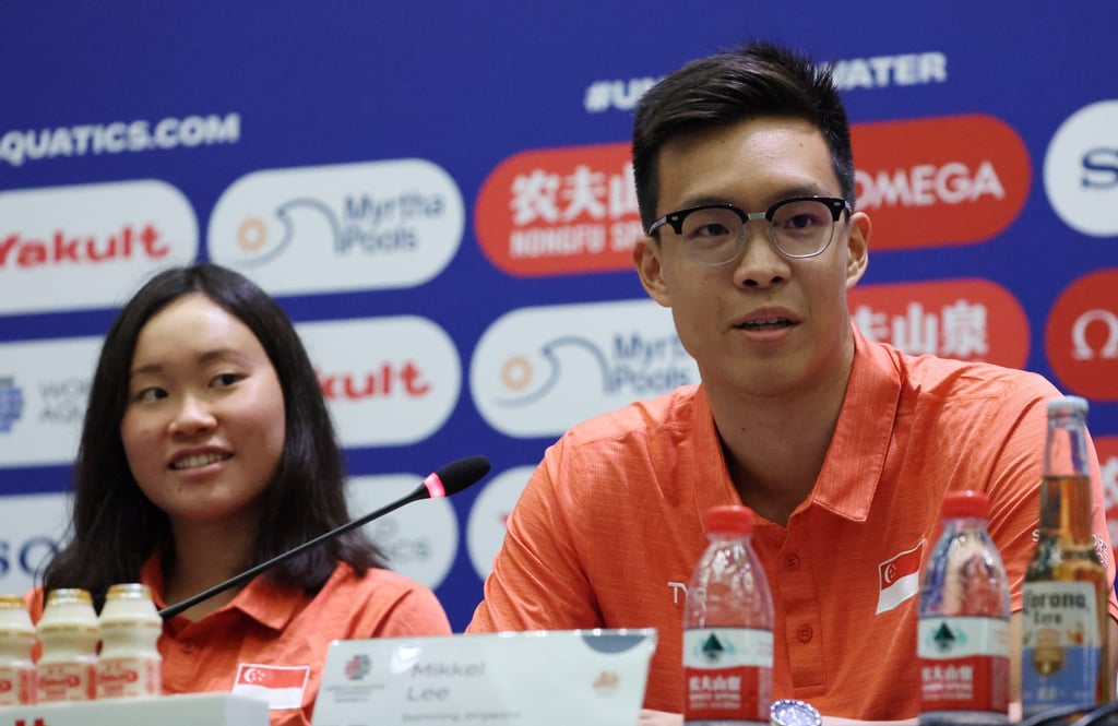 Singapore swimmers Gan Ching Hwee (left) and Mikkel Lee speak to the media ahead of the World Aquatics Championships. Photo: EPA