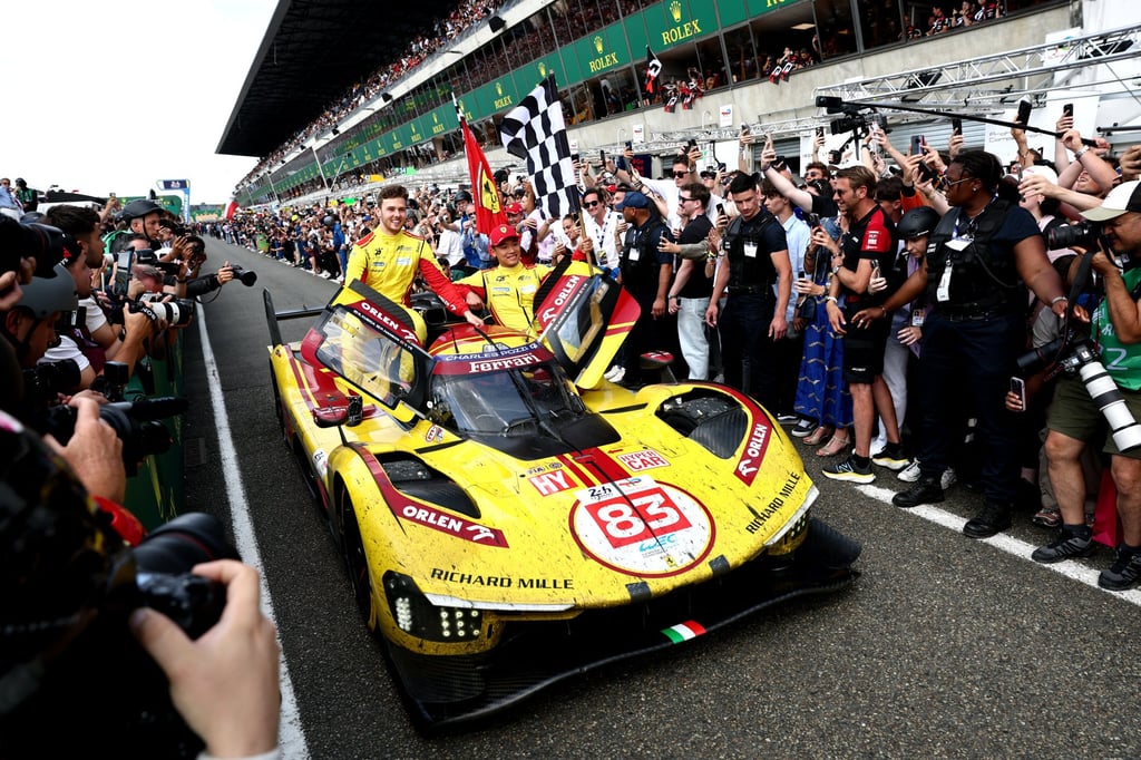 The 24 Hours of Le Mans 2025 winners Philip Hanson and Ye Yifei celebrate with the chequered flag. Photo: Reuters The 24 Hours of Le Mans 2025 winners Philip Hanson and Ye Yifei celebrate with the chequered flag. Photo: Reuters