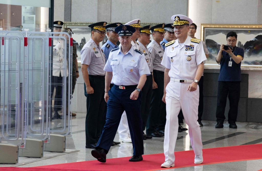 US Chairman of the Joint Chiefs of Staff Air Force General Dan Caine (left) and Admiral Kim Myung-soo, chairman of South Korea’s Joint Chiefs of Staff, inspect a guard of honour at the Ministry of National Defence in Seoul on Thursday. Photo: AFP