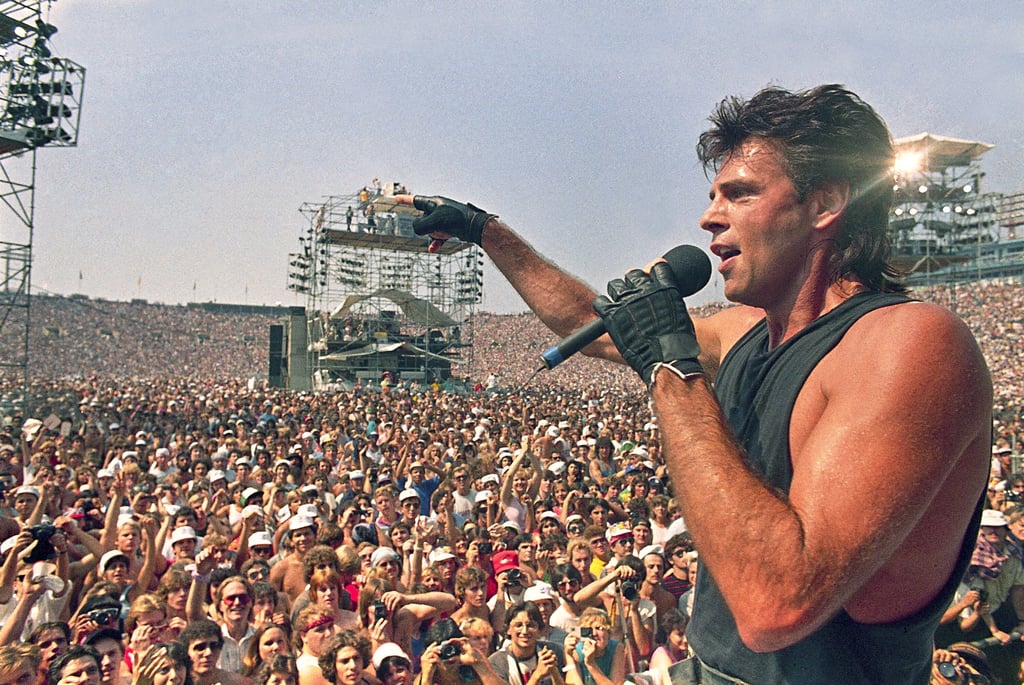 Rick Springfield performs at Live Aid at JFK Stadium in the US state of Pennsylvania on July 13, 1985. Photo: AP Rick Springfield performs at Live Aid at JFK Stadium in the US state of Pennsylvania on July 13, 1985. Photo: AP