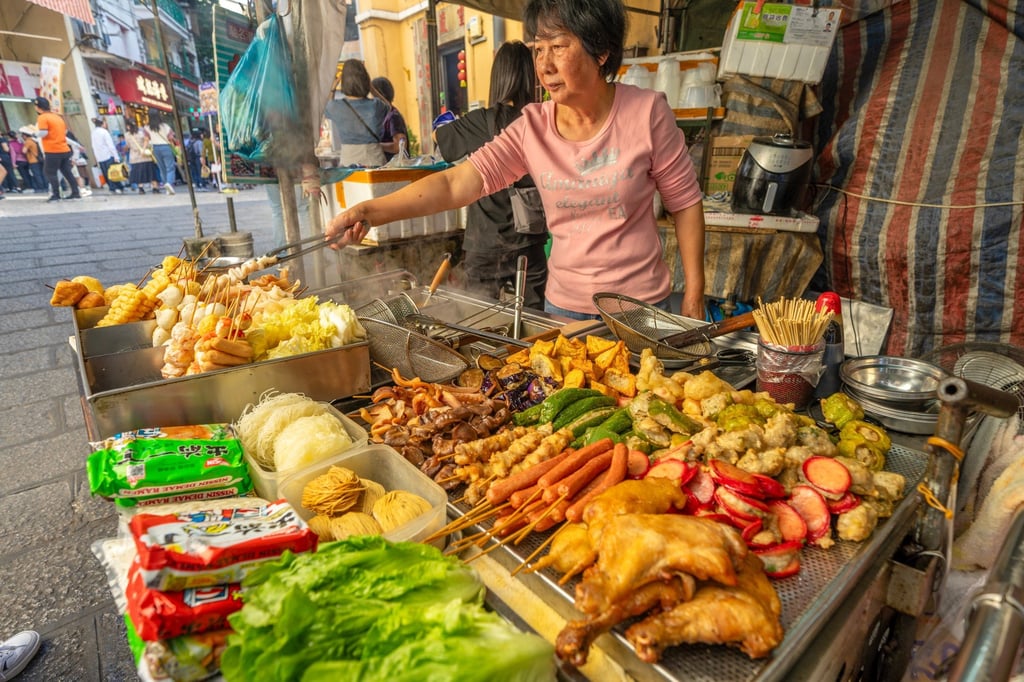 Street food and snacks at Senado Square, part of the Unesco-listed Historic Centre of Macao. Photo: Shutterstock Street food and snacks at Senado Square, part of the Unesco-listed Historic Centre of Macao. Photo: Shutterstock
