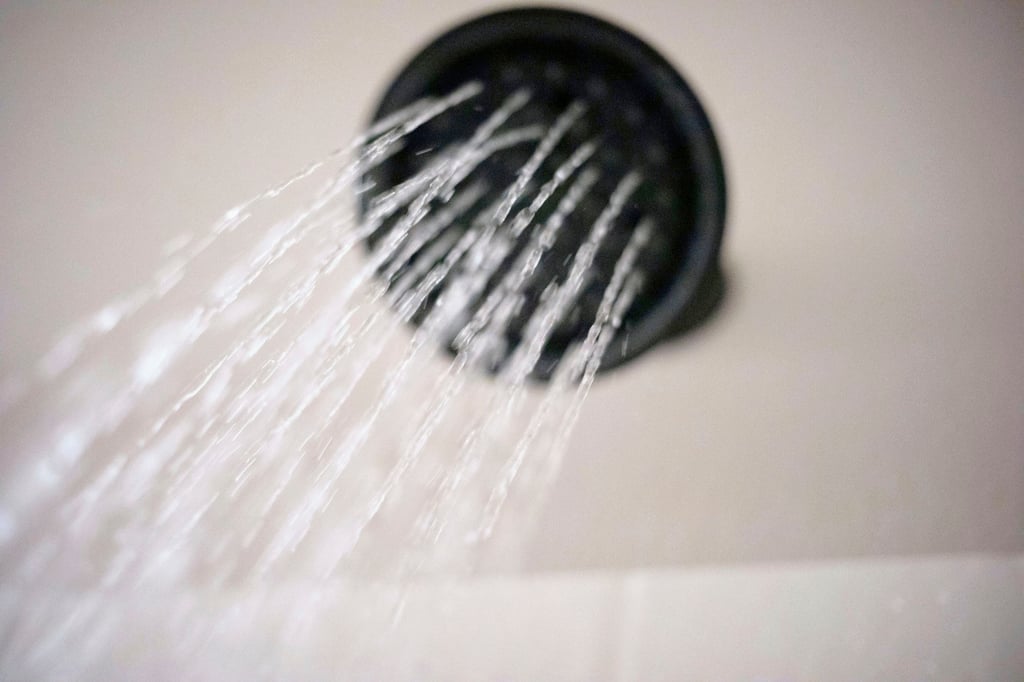 Staying in the shower too long can strip your skin of the natural oils it needs to maintain its barrier. Photo: AP Staying in the shower too long can strip your skin of the natural oils it needs to maintain its barrier. Photo: AP