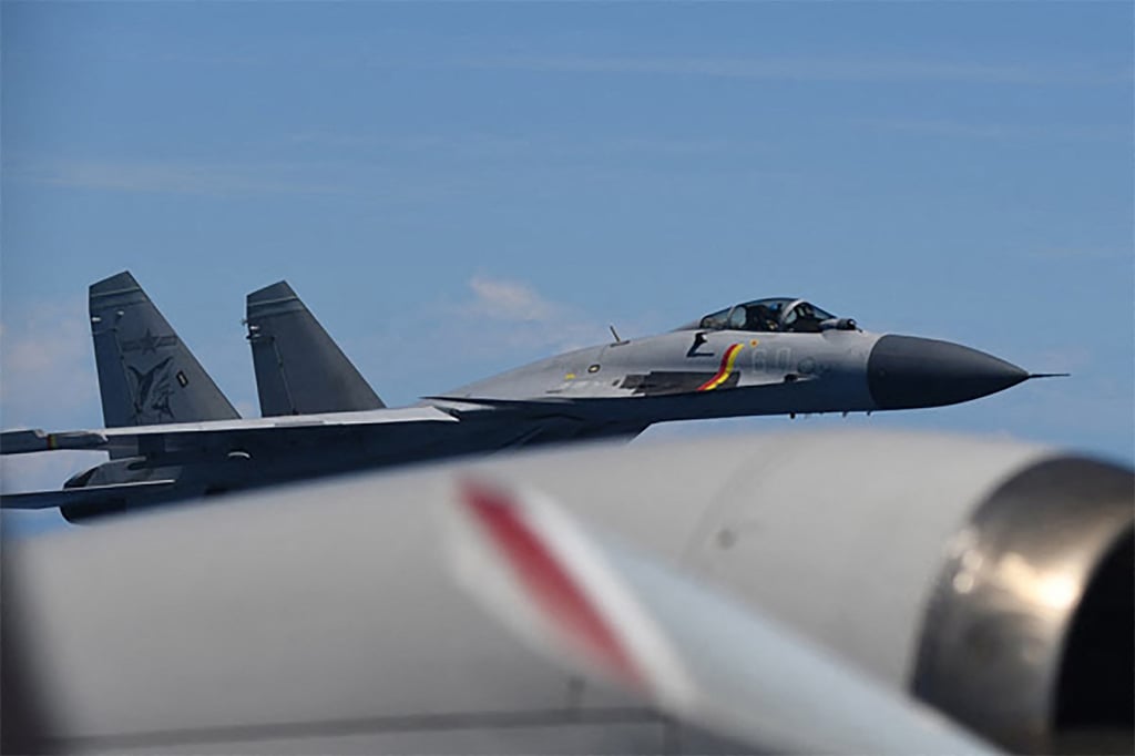 A J-15 fighter jet from the Chinese aircraft carrier Shandong making an unusual approach to a Japan Maritime Self-Defence Force P-3C patrol aircraft that was conducting surveillance above the Pacific Ocean on June 8. Photo: Japan’s Ministry of Defence / AFP A J-15 fighter jet from the Chinese aircraft carrier Shandong making an unusual approach to a Japan Maritime Self-Defence Force P-3C patrol aircraft that was conducting surveillance above the Pacific Ocean on June 8. Photo: Japan’s Ministry of Defence / AFP