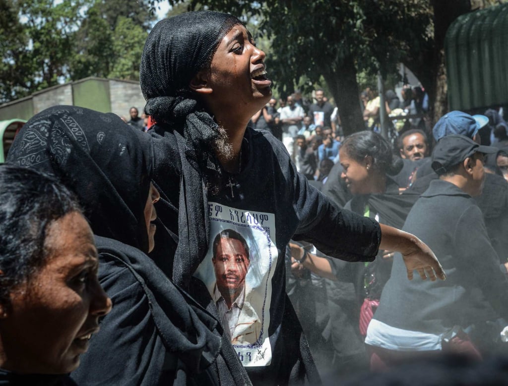 Mourners of victims of the crashed accident of Ethiopian Airlines react during the mass funeral at Holy Trinity Cathedral in Addis Ababa, Ethiopia, on March 17, 2019. Photo: AFP