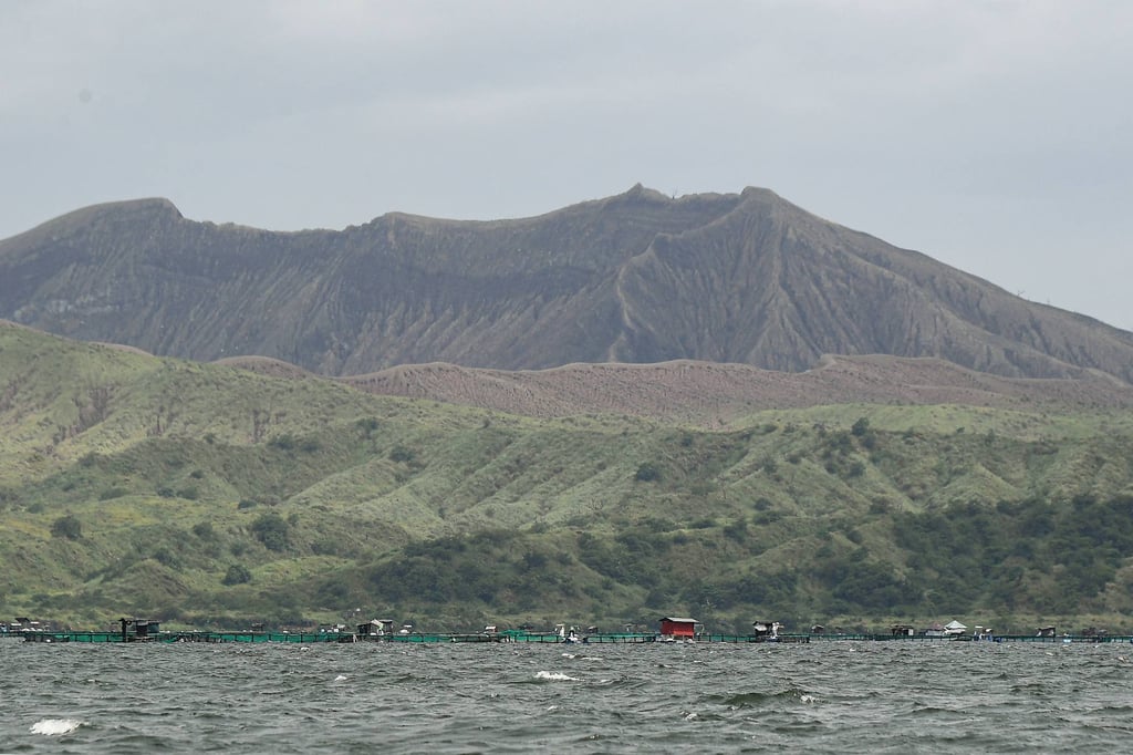 The Taal volcano crater with fish cages (bottom), seen along Taal Lake off Laurel town, Batangas province, south of Manila, on Thursday. Taal is a popular tourist spot in the Philippines. Photo: AFP The Taal volcano crater with fish cages (bottom), seen along Taal Lake off Laurel town, Batangas province, south of Manila, on Thursday. Taal is a popular tourist spot in the Philippines. Photo: AFP