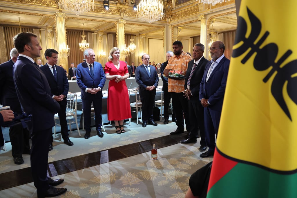 France’s President Emmanuel Macron (left) and key officials attend a summit at the Élysée Palace in Paris aimed at finding a compromise between New Caledonia’s loyalists on July 2. Photo: EPA
