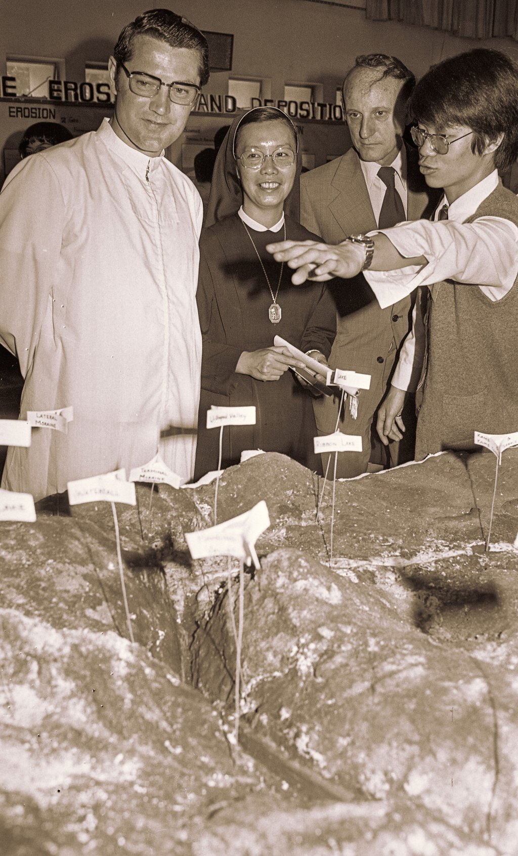 Brother Patrick (left), Sister Maria, principal of Sacred Heart Canossian College, and G.J. Grant, of the University of Hong Kong, attend a geography exhibition at St Joseph’s College in 1977. Photo: SCMP Archives Brother Patrick (left), Sister Maria, principal of Sacred Heart Canossian College, and G.J. Grant, of the University of Hong Kong, attend a geography exhibition at St Joseph’s College in 1977. Photo: SCMP Archives