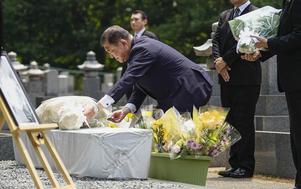 Japanese Prime Minster Shigeru Ishiba lays flowers at a memorial for former prime minister Shinzo Abe in a cemetery in the western Japan city of Nara on Tuesday, the third anniversary of his assassination in the city. Photo: Kyodo Japanese Prime Minster Shigeru Ishiba lays flowers at a memorial for former prime minister Shinzo Abe in a cemetery in the western Japan city of Nara on Tuesday, the third anniversary of his assassination in the city. Photo: Kyodo