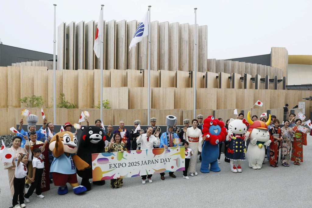 Mascots and expo staff pose for a photo in front of the Japan Pavilion at the World Expo in Osaka on July 3. Photo: Kyodo Mascots and expo staff pose for a photo in front of the Japan Pavilion at the World Expo in Osaka on July 3. Photo: Kyodo