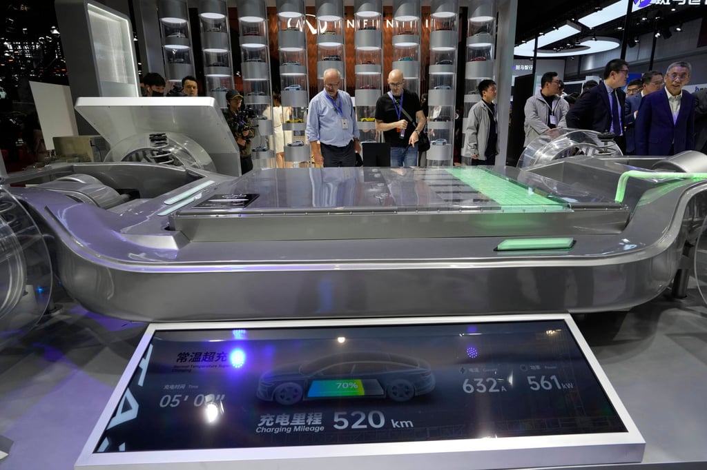 Visitors look at the fast-charging battery from CATL that promises 520km from 5 minutes of charging. Photo: AP Visitors look at the fast-charging battery from CATL that promises 520km from 5 minutes of charging. Photo: AP
