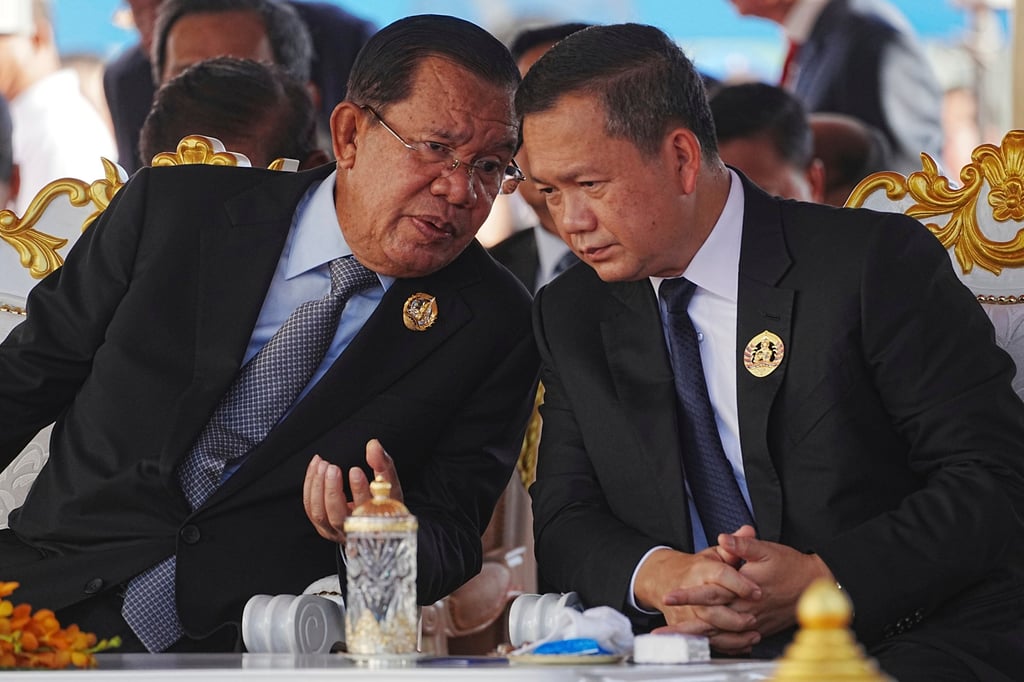 Hun Sen talks to his son, Prime Minister Hun Manet (right) during an anniversary on June 28 celebrating the 74th founding of the Cambodian People’s Party. Photo: AP Hun Sen talks to his son, Prime Minister Hun Manet (right) during an anniversary on June 28 celebrating the 74th founding of the Cambodian People’s Party. Photo: AP
