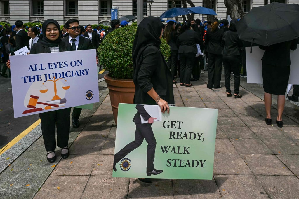 Malaysian Bar Council members hold placards during a rally near the prime minister’s office in Putrajaya on Monday to protest against the delay in appointing the country’s top judges. Photo: AFP Malaysian Bar Council members hold placards during a rally near the prime minister’s office in Putrajaya on Monday to protest against the delay in appointing the country’s top judges. Photo: AFP