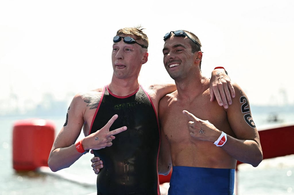 Winner Florian Wellbrock (left) celebrates with second-placed Italian Gregorio Paltrinieri. Photo: AFP