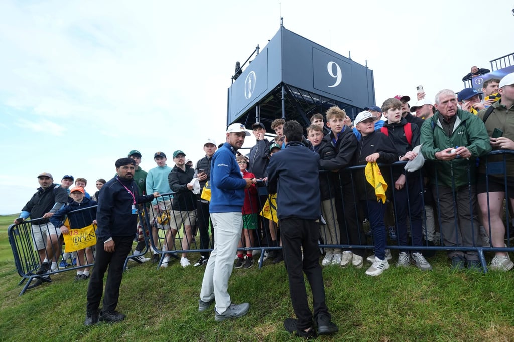 Bryson DeChambeau signs autographs by the 9th green at Royal Portrush. Photo: AP