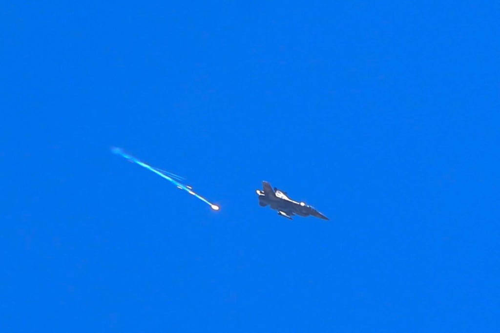 An Israeli fighter aircraft fires a flare above the city of Sweida in Syria on Tuesday. Photo: AFP An Israeli fighter aircraft fires a flare above the city of Sweida in Syria on Tuesday. Photo: AFP