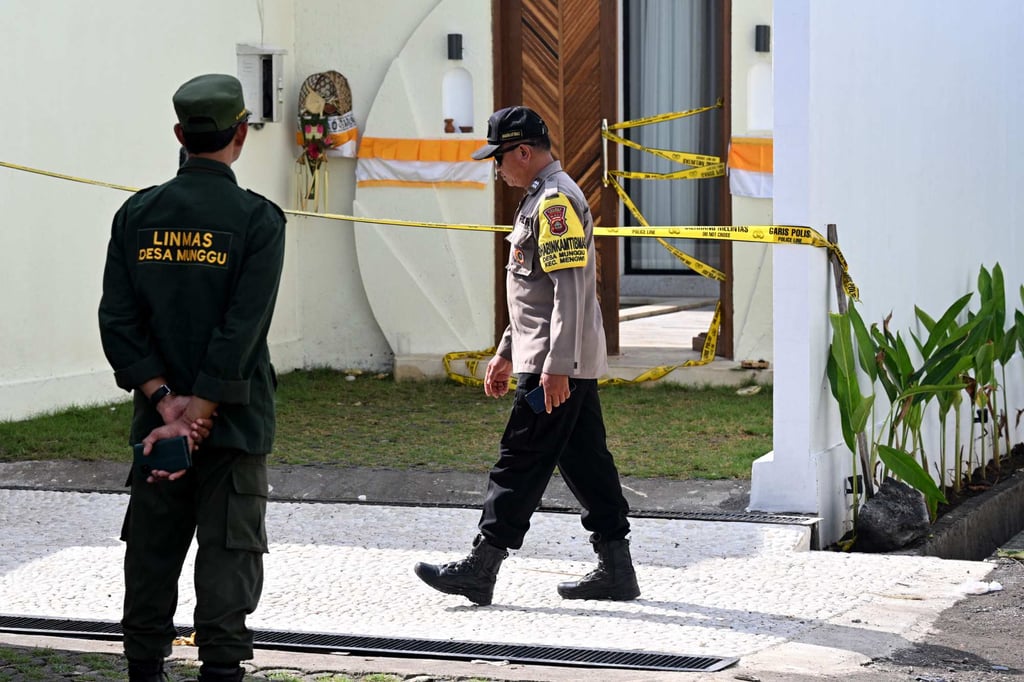 A police officer walks past the villa in Bali where Australian national Zivan Radmanovic was shot dead and another man injured, on June 15. Photo: AFP