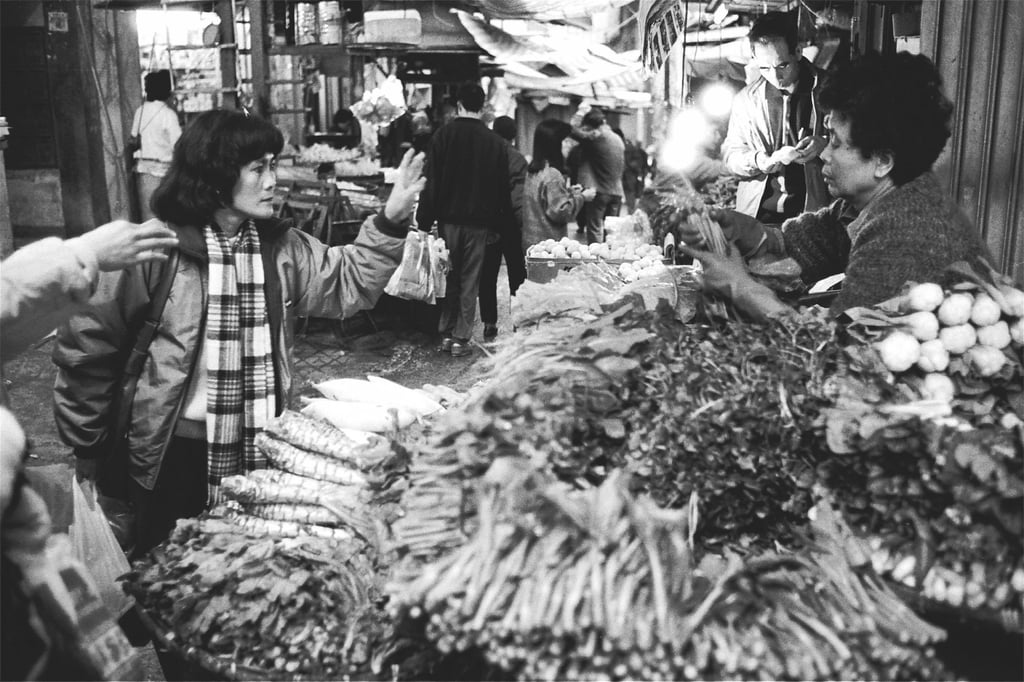 A shopper buys vegetables in January 1989. Photo: SCMP Archives A shopper buys vegetables in January 1989. Photo: SCMP Archives