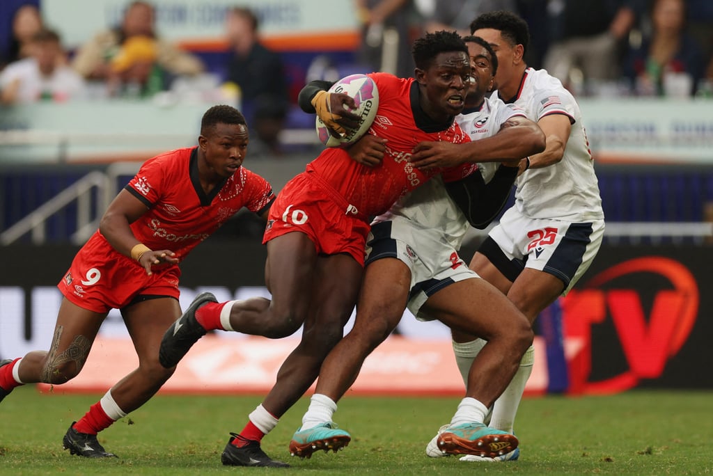 Kenya (red) and United States do battle during the Hong Kong Sevens 2025 at Kai Tak Stadium. Photo: Reuters Kenya (red) and United States do battle during the Hong Kong Sevens 2025 at Kai Tak Stadium. Photo: Reuters