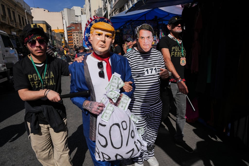 Protesters in São Paulo, Brazil, demand the arrest of former president Jair Bolsonaro and oppose Trump’s decision to investigate digital trade and electronic payment services in Brazil. Photo: Reuters