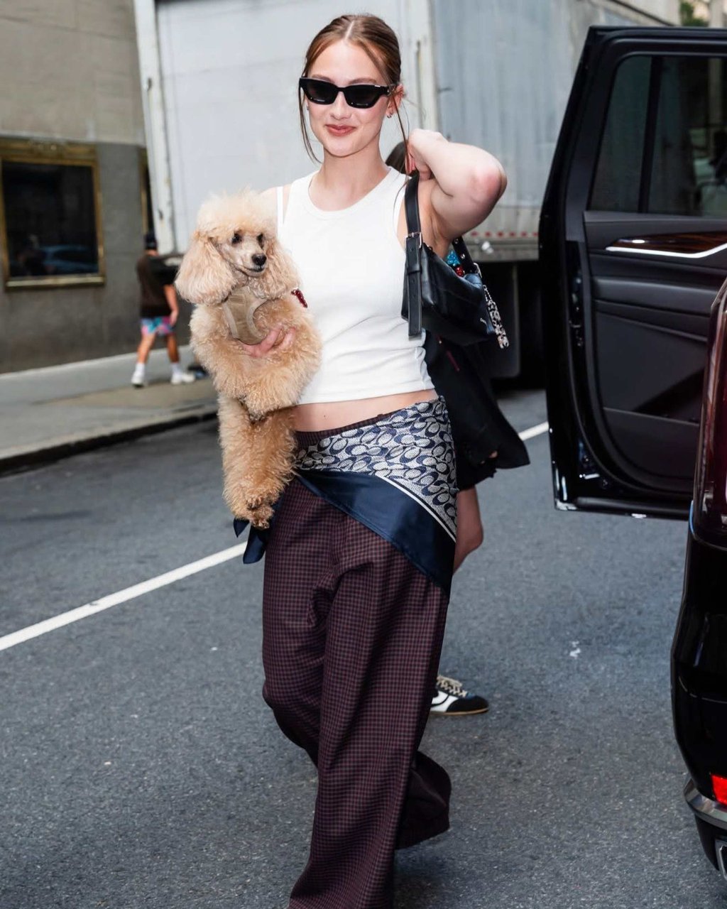 Tung with the new Alter/Ego mini bag from Coachtopia and a Coach silk scarf casually worn on the hips. Photo: @lolaflorals/Instagram