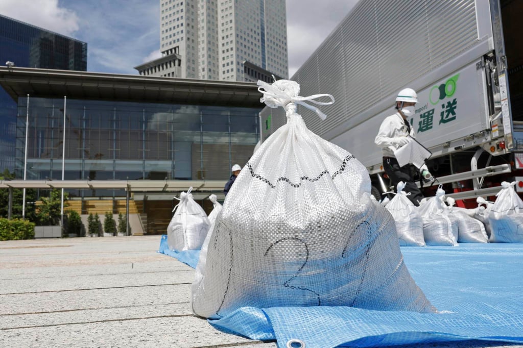 A bag of slightly radioactive but decontaminated soil from Fukushima, is delivered to the Japanese prime minister’s office on Saturday. Photo: AP A bag of slightly radioactive but decontaminated soil from Fukushima, is delivered to the Japanese prime minister’s office on Saturday. Photo: AP