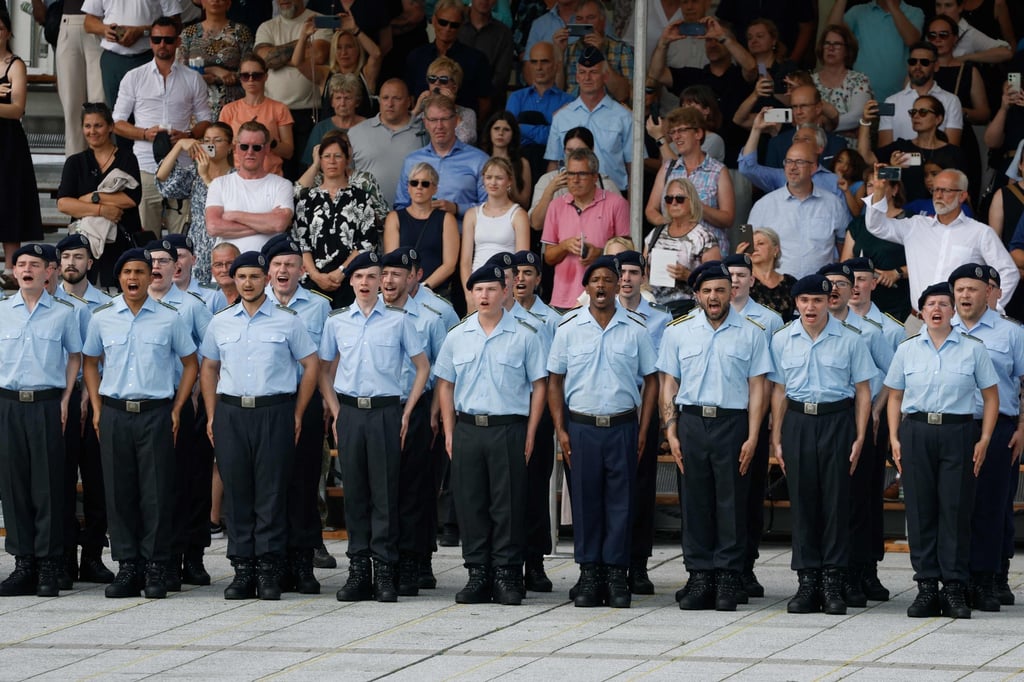 A group of recruits swear their oath of allegiance with their families present at the Defence Ministry in Berlin on Sunday. Photo: AFP